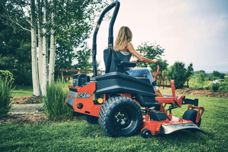 Woman mowing her lawn