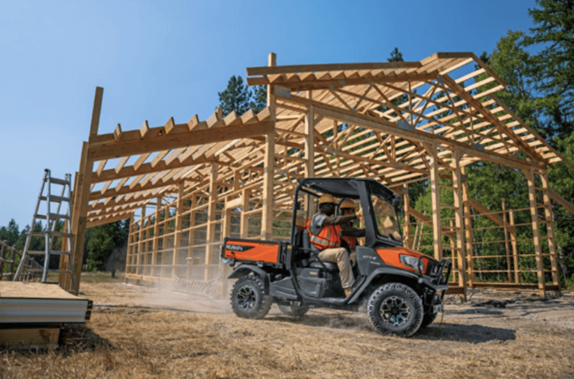 Construction crew riding in an RTV