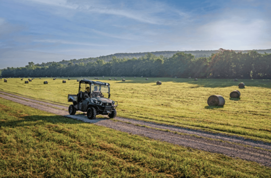 Kubot RTV driving down dirt road