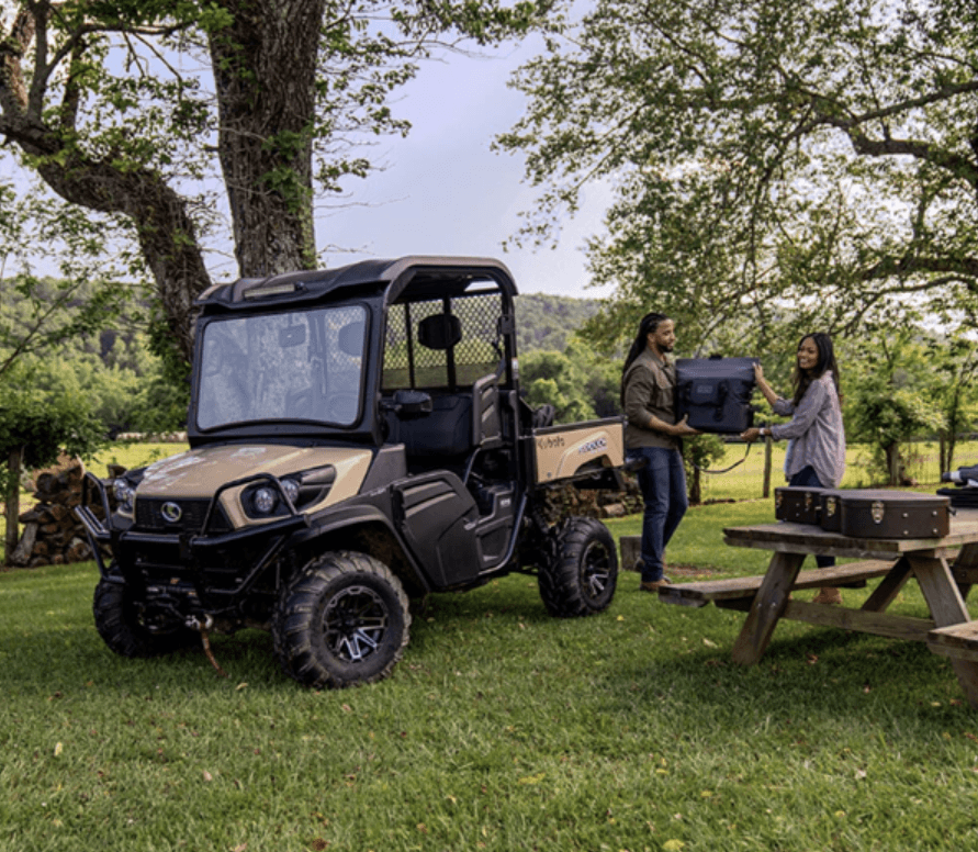 A couple unloading their RTV