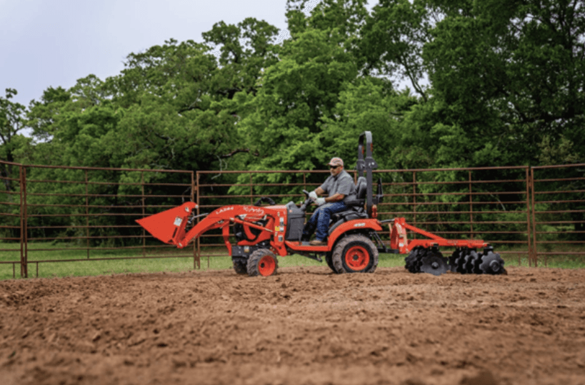Man plowing a field with tractor