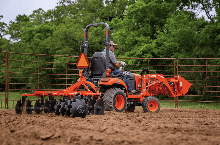 Man plowing field with tractor