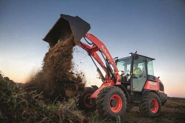 Wheel Loader dumping dirt onto pile