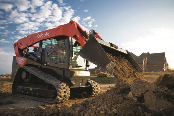 Track Loader dumping dirt onto pile