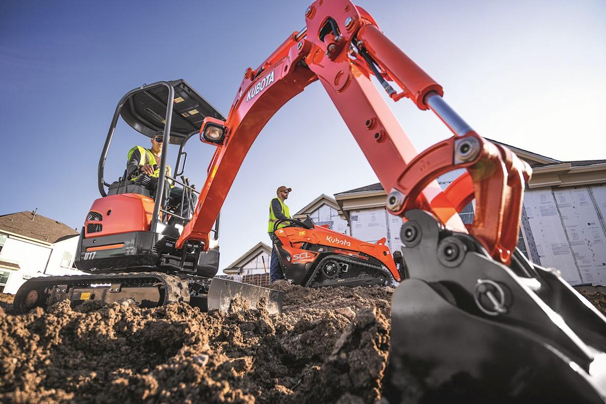 Worker digging with excavator