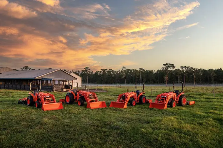 Kubota Tractor lineup in a scenic field