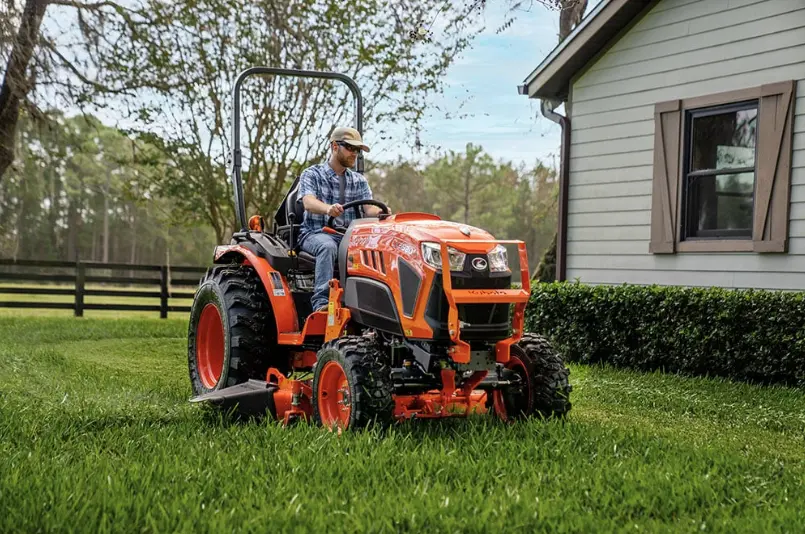 Man using mid mount mower to mow his lawn