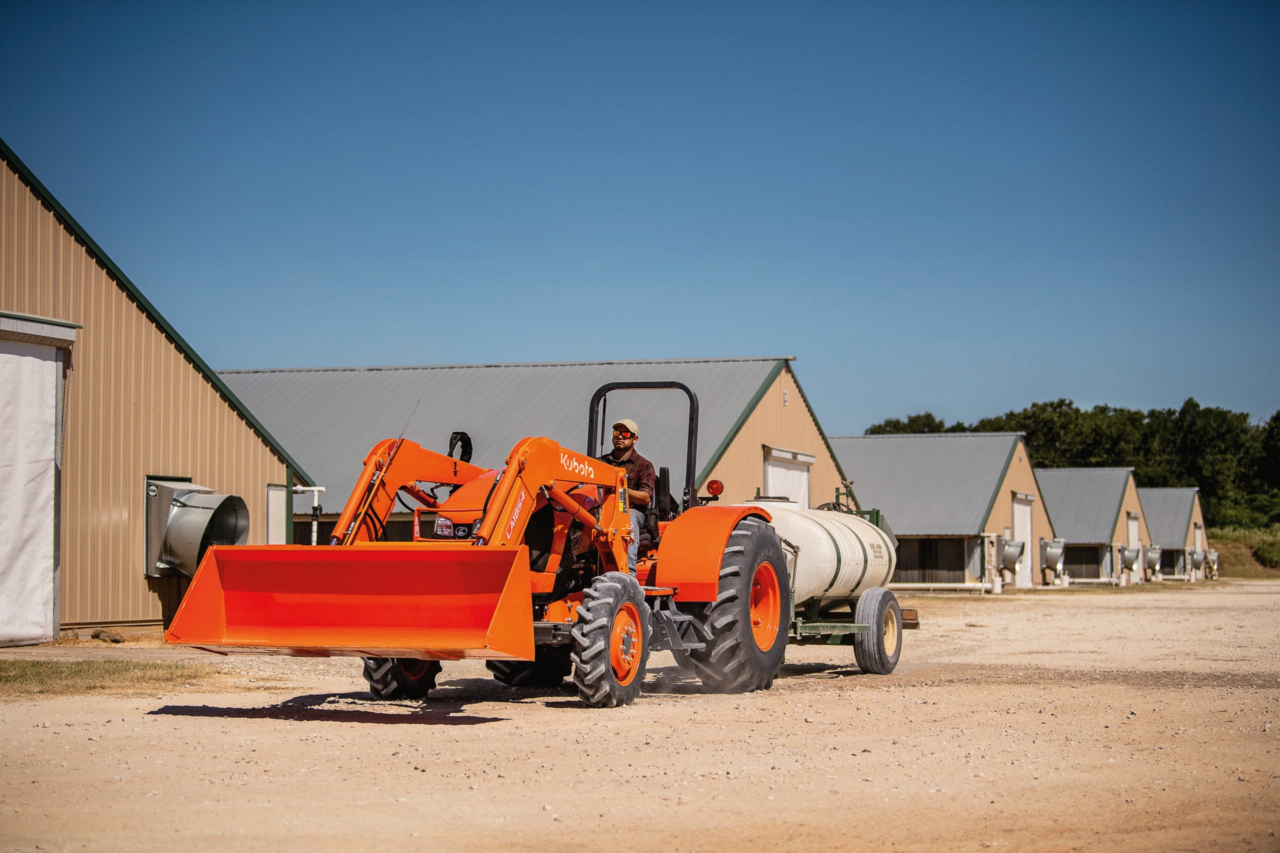 Kubota Utility Tractor hauling a water tank