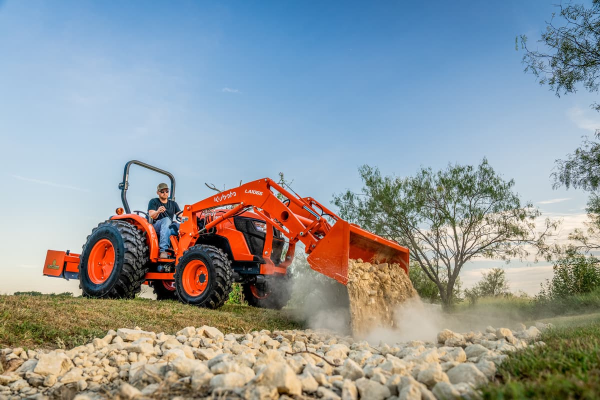 Kubota MX4900 dumping gravel
